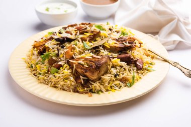 Kathal Biryani is made using raw jackfruit pieces cooked slowly with a variety of spices and mixed with basmati rice. served with curd and salan. Indian vegetarian food