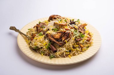 Kathal Biryani is made using raw jackfruit pieces cooked slowly with a variety of spices and mixed with basmati rice. served with curd and salan. Indian vegetarian food