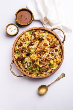 Kathal Biryani is made using raw jackfruit pieces cooked slowly with a variety of spices and mixed with basmati rice. served with curd and salan. Indian vegetarian food