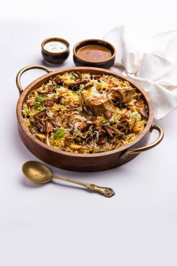 Kathal Biryani is made using raw jackfruit pieces cooked slowly with a variety of spices and mixed with basmati rice. served with curd and salan. Indian vegetarian food