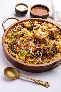 Kathal Biryani is made using raw jackfruit pieces cooked slowly with a variety of spices and mixed with basmati rice. served with curd and salan. Indian vegetarian food
