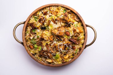 Kathal Biryani is made using raw jackfruit pieces cooked slowly with a variety of spices and mixed with basmati rice. served with curd and salan. Indian vegetarian food