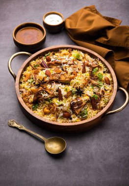 Kathal Biryani is made using raw jackfruit pieces cooked slowly with a variety of spices and mixed with basmati rice. served with curd and salan. Indian vegetarian food