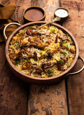 Kathal Biryani is made using raw jackfruit pieces cooked slowly with a variety of spices and mixed with basmati rice. served with curd and salan. Indian vegetarian food
