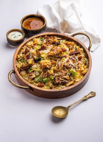 Kathal Biryani is made using raw jackfruit pieces cooked slowly with a variety of spices and mixed with basmati rice. served with curd and salan. Indian vegetarian food