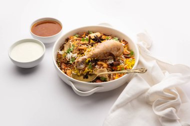 Restaurant style Spicy Chicken Biryani served with Raita and Salan, Popular Indian or Pakistani non vegetarian Food