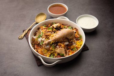 Restaurant style Spicy Chicken Biryani served with Raita and Salan, Popular Indian or Pakistani non vegetarian Food
