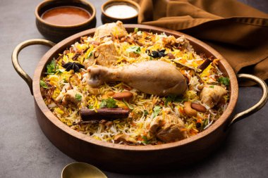 Restaurant style Spicy Chicken Biryani served with Raita and Salan, Popular Indian or Pakistani non vegetarian Food