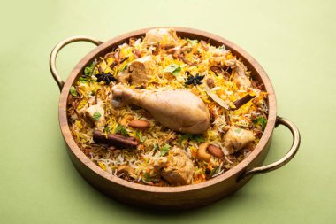 Restaurant style Spicy Chicken Biryani served with Raita and Salan, Popular Indian or Pakistani non vegetarian Food