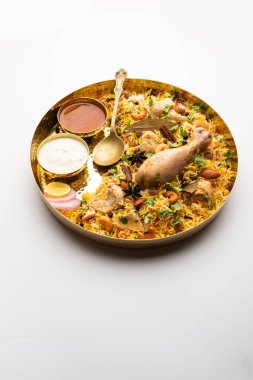 Restaurant style Spicy Chicken Biryani served with Raita and Salan, Popular Indian or Pakistani non vegetarian Food