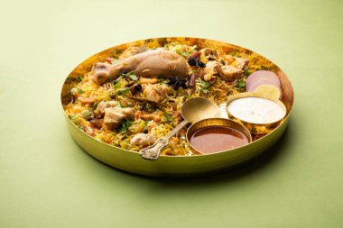 Restaurant style Spicy Chicken Biryani served with Raita and Salan, Popular Indian or Pakistani non vegetarian Food