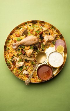 Restaurant style Spicy Chicken Biryani served with Raita and Salan, Popular Indian or Pakistani non vegetarian Food