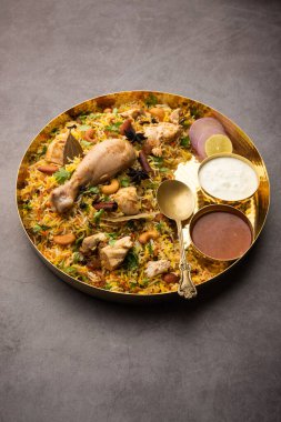 Restaurant style Spicy Chicken Biryani served with Raita and Salan, Popular Indian or Pakistani non vegetarian Food