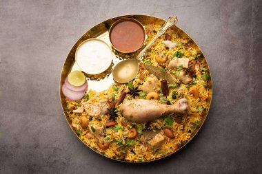 Restaurant style Spicy Chicken Biryani served with Raita and Salan, Popular Indian or Pakistani non vegetarian Food
