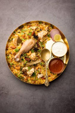 Restaurant style Spicy Chicken Biryani served with Raita and Salan, Popular Indian or Pakistani non vegetarian Food