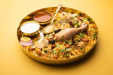 Restaurant style Spicy Chicken Biryani served with Raita and Salan, Popular Indian or Pakistani non vegetarian Food
