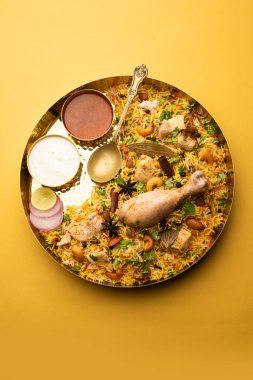 Restaurant style Spicy Chicken Biryani served with Raita and Salan, Popular Indian or Pakistani non vegetarian Food