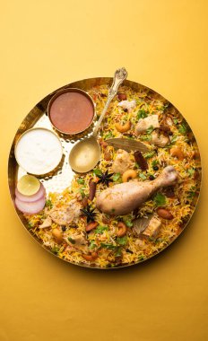 Restaurant style Spicy Chicken Biryani served with Raita and Salan, Popular Indian or Pakistani non vegetarian Food