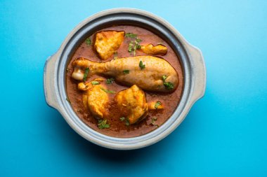 Spicy Reddish Chicken Curry or red Murgh Masala or korma. Indian non-vegetarian food. selective focus.