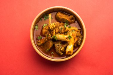 Indian style meat dish or Mutton OR Gosht Masala OR lamb rogan josh served in a bowl, selective focus