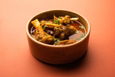 Indian style meat dish or Mutton OR Gosht Masala OR lamb rogan josh served in a bowl, selective focus