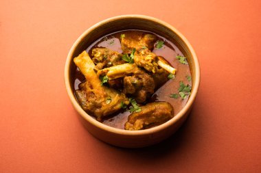 Indian style meat dish or Mutton OR Gosht Masala OR lamb rogan josh served in a bowl, selective focus
