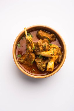 Indian style meat dish or Mutton OR Gosht Masala OR lamb rogan josh served in a bowl, selective focus