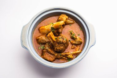 Indian style meat dish or Mutton OR Gosht Masala OR lamb rogan josh served in a bowl, selective focus