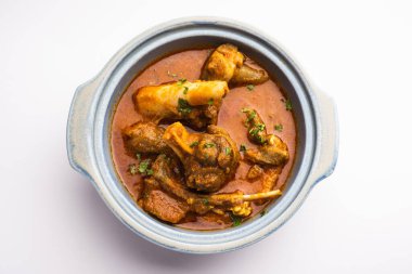 Indian style meat dish or Mutton OR Gosht Masala OR lamb rogan josh served in a bowl, selective focus