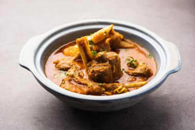 Indian style meat dish or Mutton OR Gosht Masala OR lamb rogan josh served in a bowl, selective focus