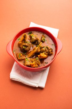 Indian style meat dish or Mutton OR Gosht Masala OR lamb rogan josh served in a bowl, selective focus