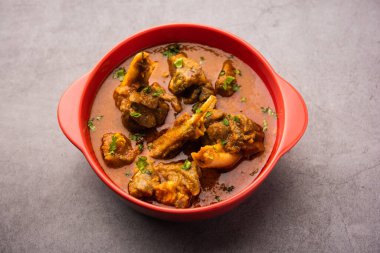 Indian style meat dish or Mutton OR Gosht Masala OR lamb rogan josh served in a bowl, selective focus