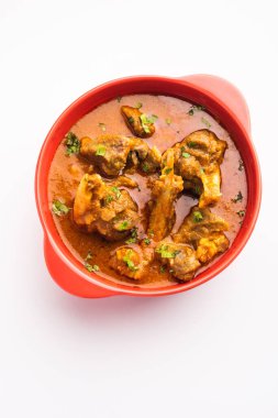 Indian style meat dish or Mutton OR Gosht Masala OR lamb rogan josh served in a bowl, selective focus