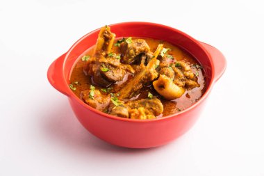 Indian style meat dish or Mutton OR Gosht Masala OR lamb rogan josh served in a bowl, selective focus