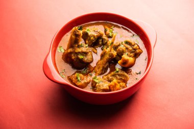 Indian style meat dish or Mutton OR Gosht Masala OR lamb rogan josh served in a bowl, selective focus