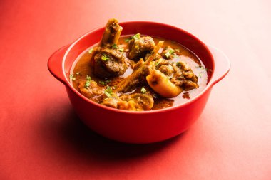 Indian style meat dish or Mutton OR Gosht Masala OR lamb rogan josh served in a bowl, selective focus