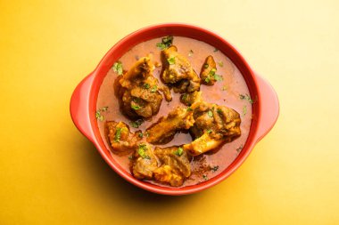 Indian style meat dish or Mutton OR Gosht Masala OR lamb rogan josh served in a bowl, selective focus