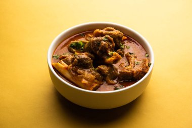 Indian style meat dish or Mutton OR Gosht Masala OR lamb rogan josh served in a bowl, selective focus