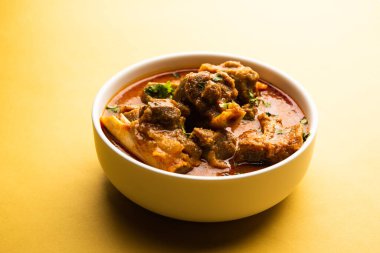 Indian style meat dish or Mutton OR Gosht Masala OR lamb rogan josh served in a bowl, selective focus
