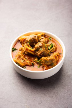 Indian style meat dish or Mutton OR Gosht Masala OR lamb rogan josh served in a bowl, selective focus