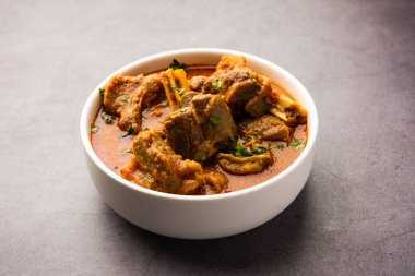 Indian style meat dish or Mutton OR Gosht Masala OR lamb rogan josh served in a bowl, selective focus