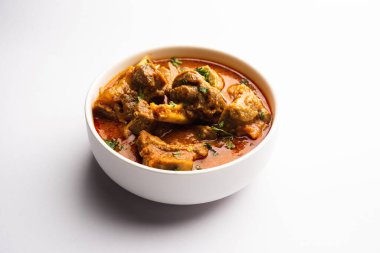 Indian style meat dish or Mutton OR Gosht Masala OR lamb rogan josh served in a bowl, selective focus