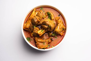 Indian style meat dish or Mutton OR Gosht Masala OR lamb rogan josh served in a bowl, selective focus