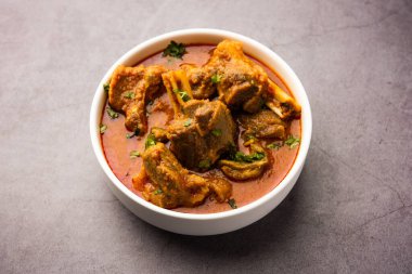 Indian style meat dish or Mutton OR Gosht Masala OR lamb rogan josh served in a bowl, selective focus