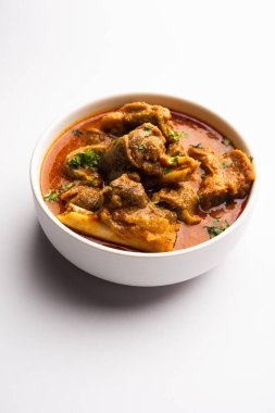 Indian style meat dish or Mutton OR Gosht Masala OR lamb rogan josh served in a bowl, selective focus