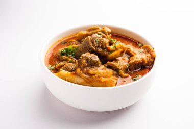 Indian style meat dish or Mutton OR Gosht Masala OR lamb rogan josh served in a bowl, selective focus