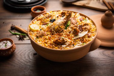 Dum Handi chicken Biryani is prepared in an earthen or clay pot called Haandi. Popular Indian non vegetarian food clipart