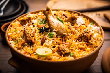 Dum Handi chicken Biryani is prepared in an earthen or clay pot called Haandi. Popular Indian non vegetarian food clipart