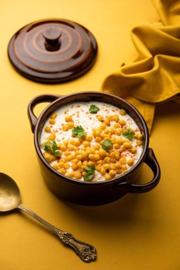 Boondi raita is a North Indian side dish variety made with spiced yogurt and boondi or crisp fried gram flour balls clipart
