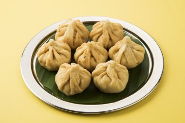 Indian Sweet - Modak made of coconut - favourite of lord ganesha on banana leaf
